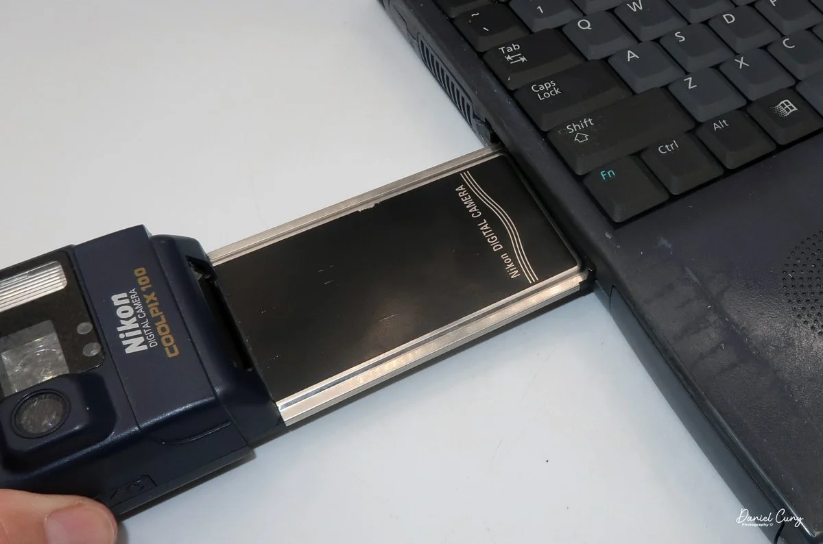 Sliding PCMCIA card into the computer