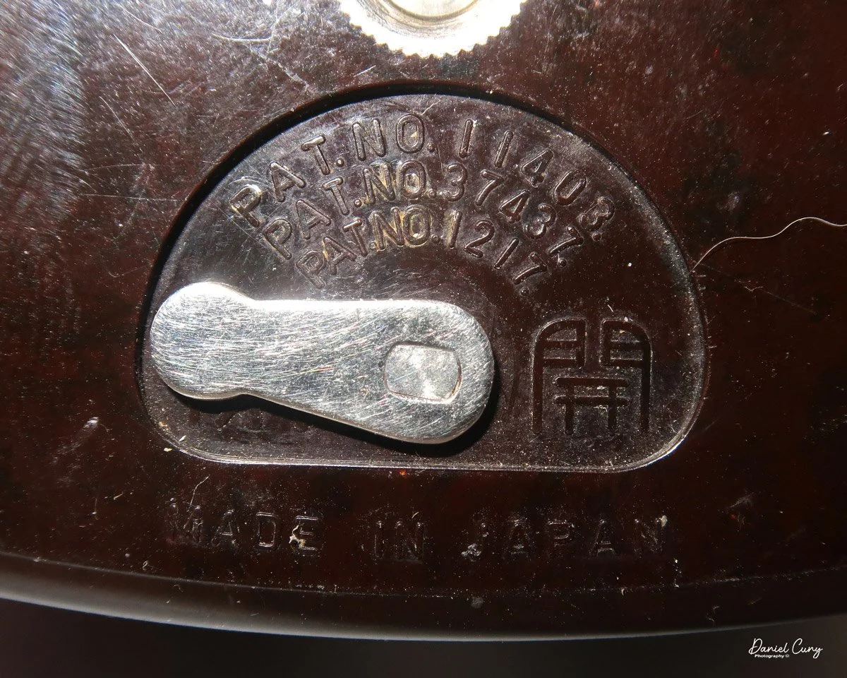 Latch to lock/unlock film chamber