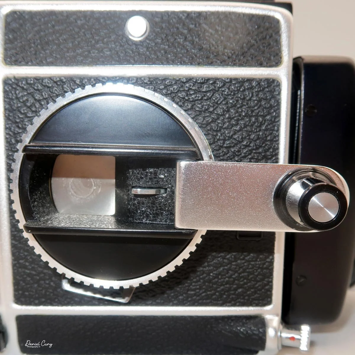 Double-exposure tab inside widing lever.