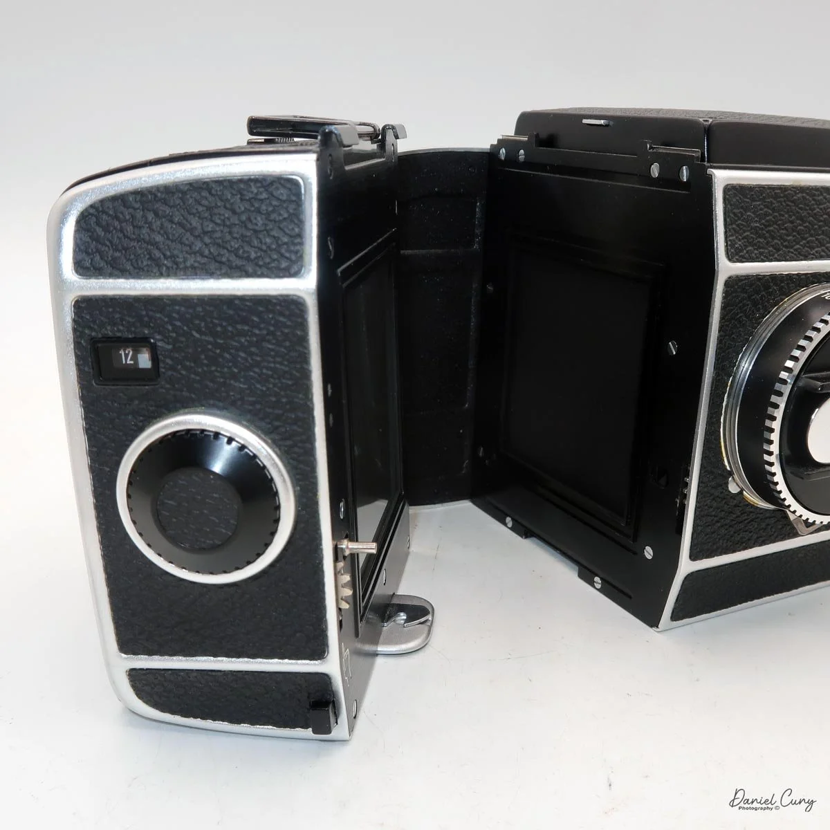 Film back slides up from the bottom