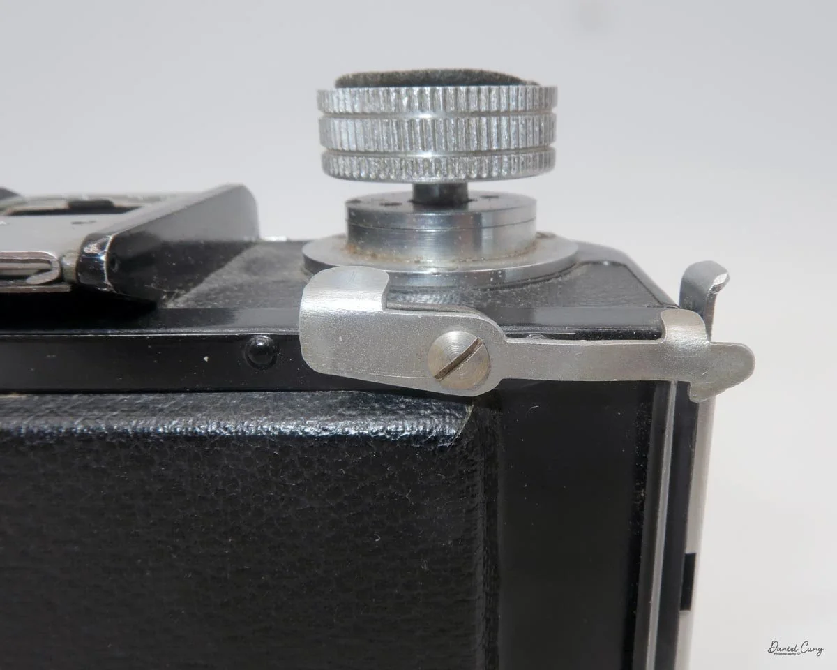 Flip up tab to remove back to use film holders.