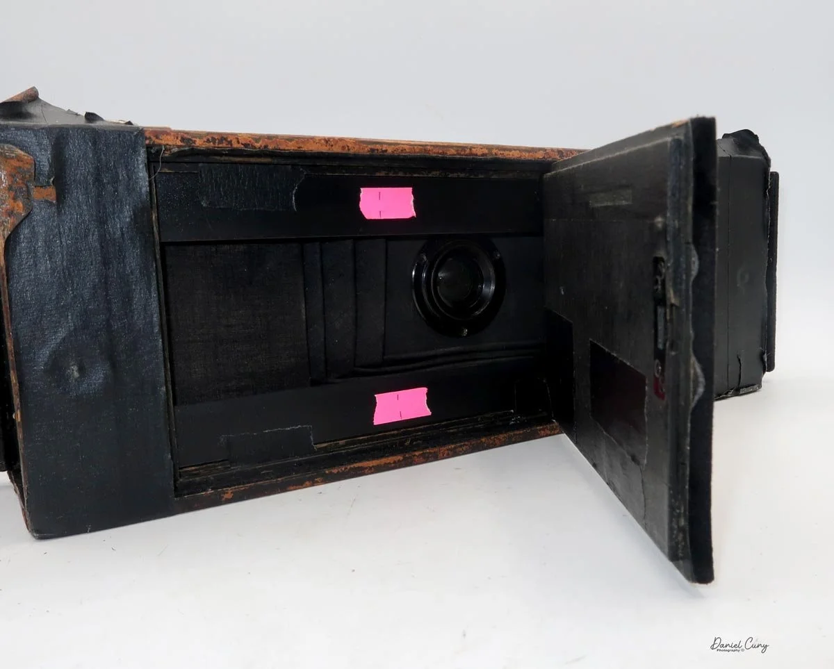 Hinged film door to load film.