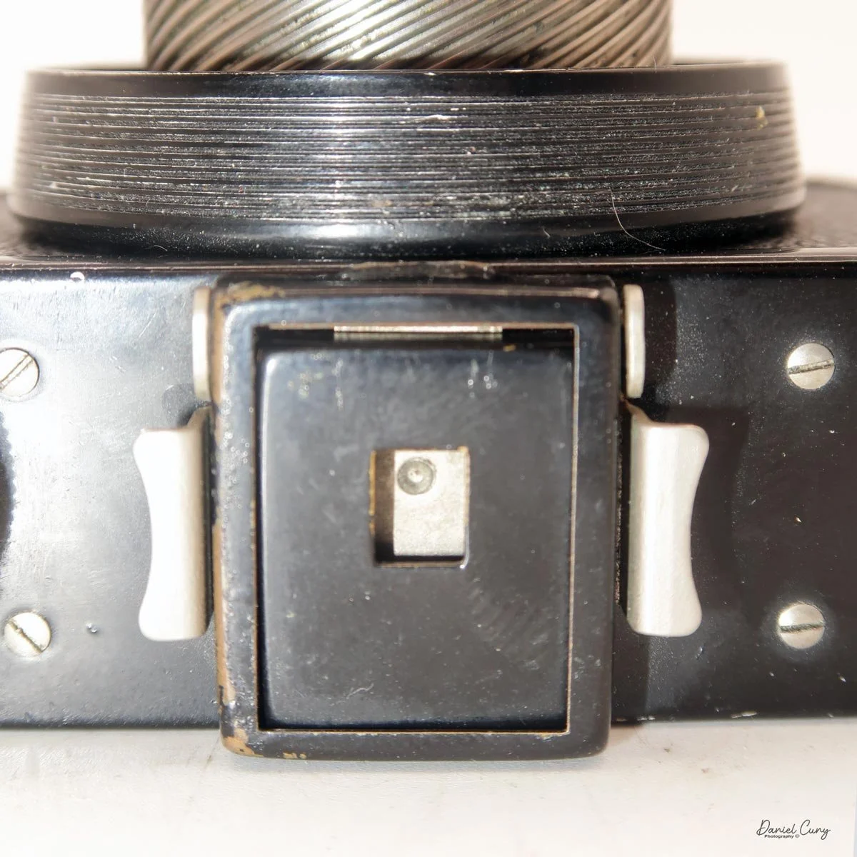 Viewfinder closed-Note grips on side to lift film chamber