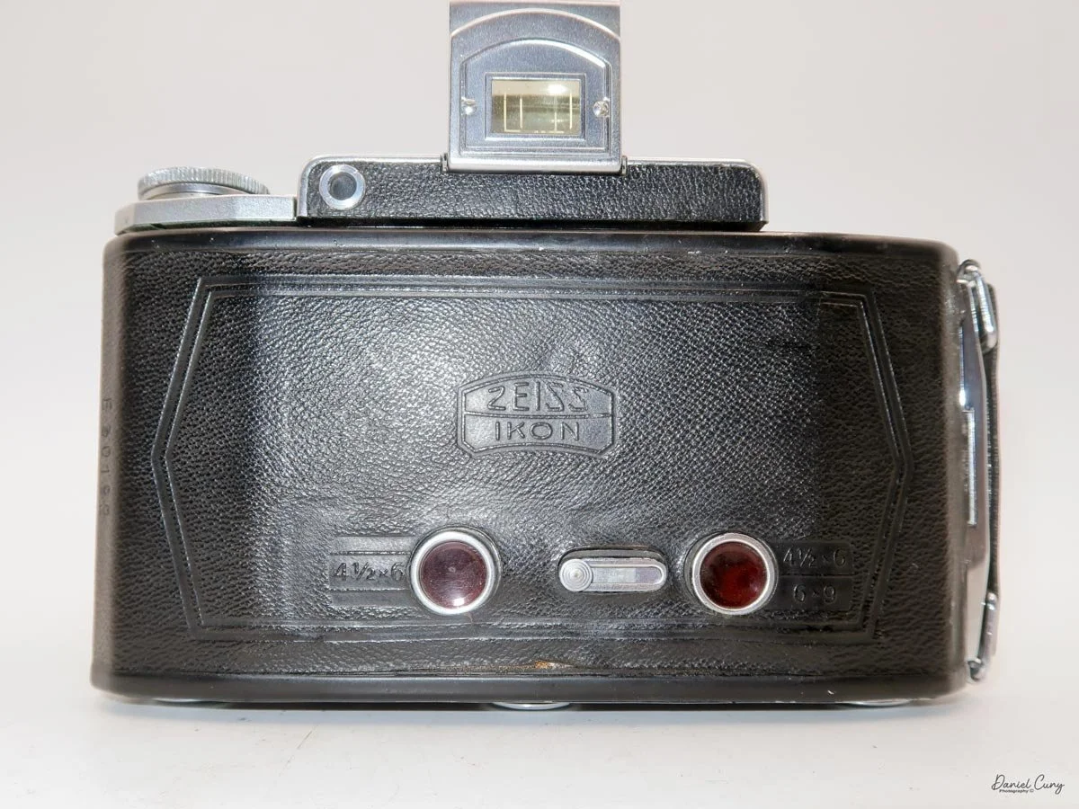 Camera's back w/two red windows.