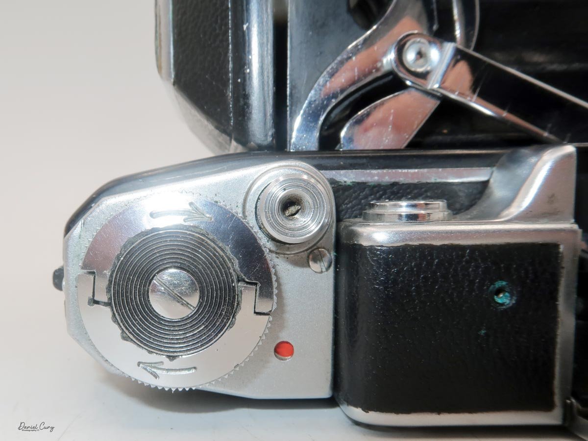 Winding lever w/red dot in window.