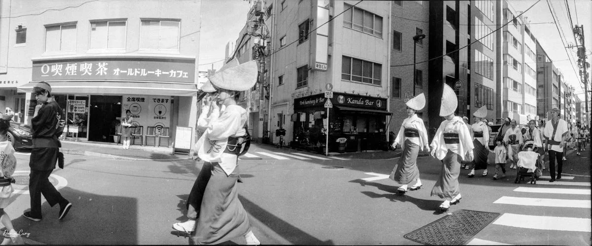 Costumed people walking the street in Tokyo.