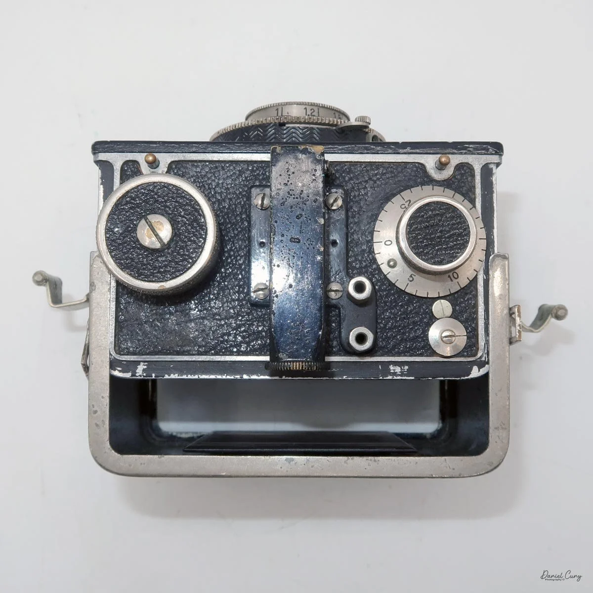 Film back slides off camera body.