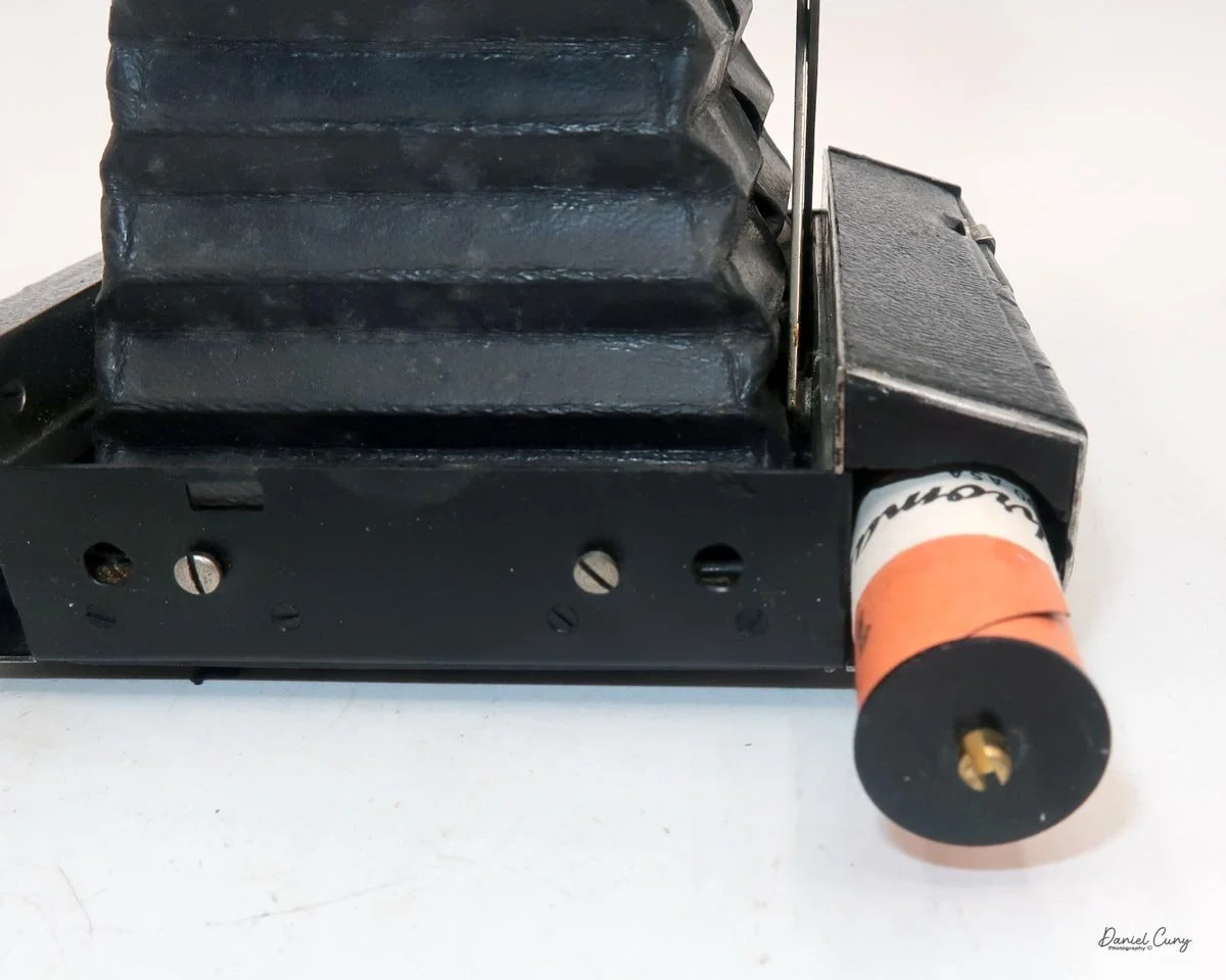 127 film fits into side slots.