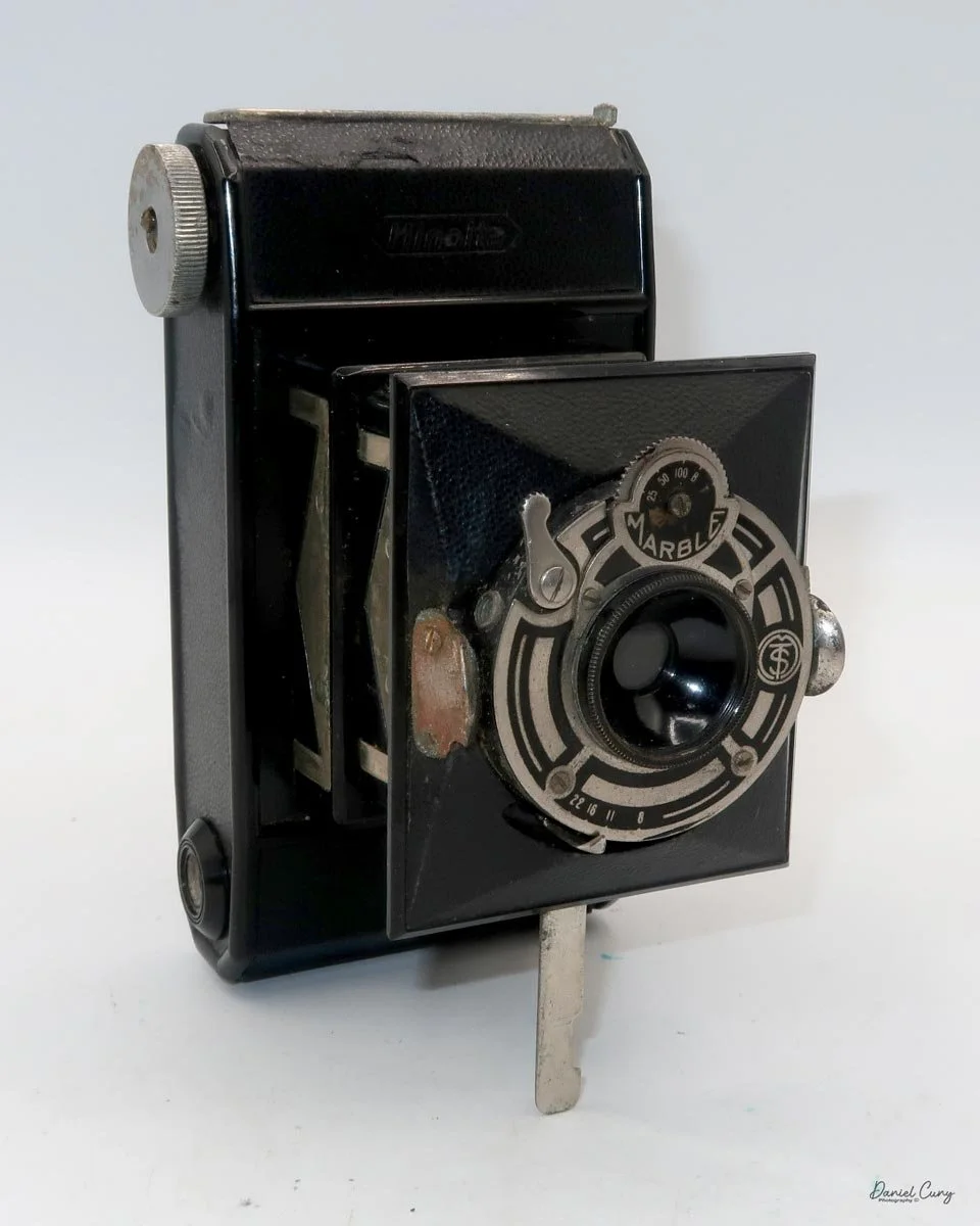 Different angles of the Minolta Vest camera