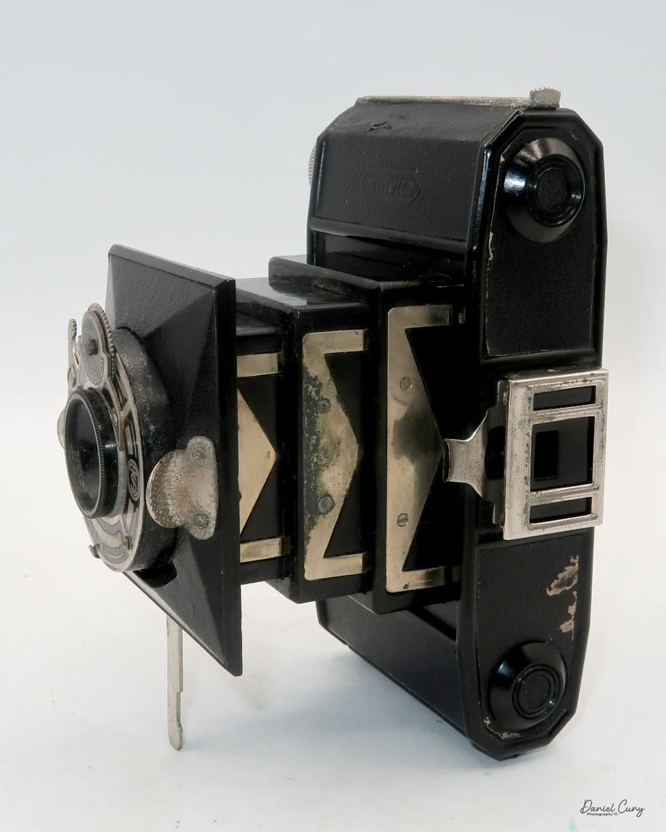 Different angles of the Minolta Vest camera