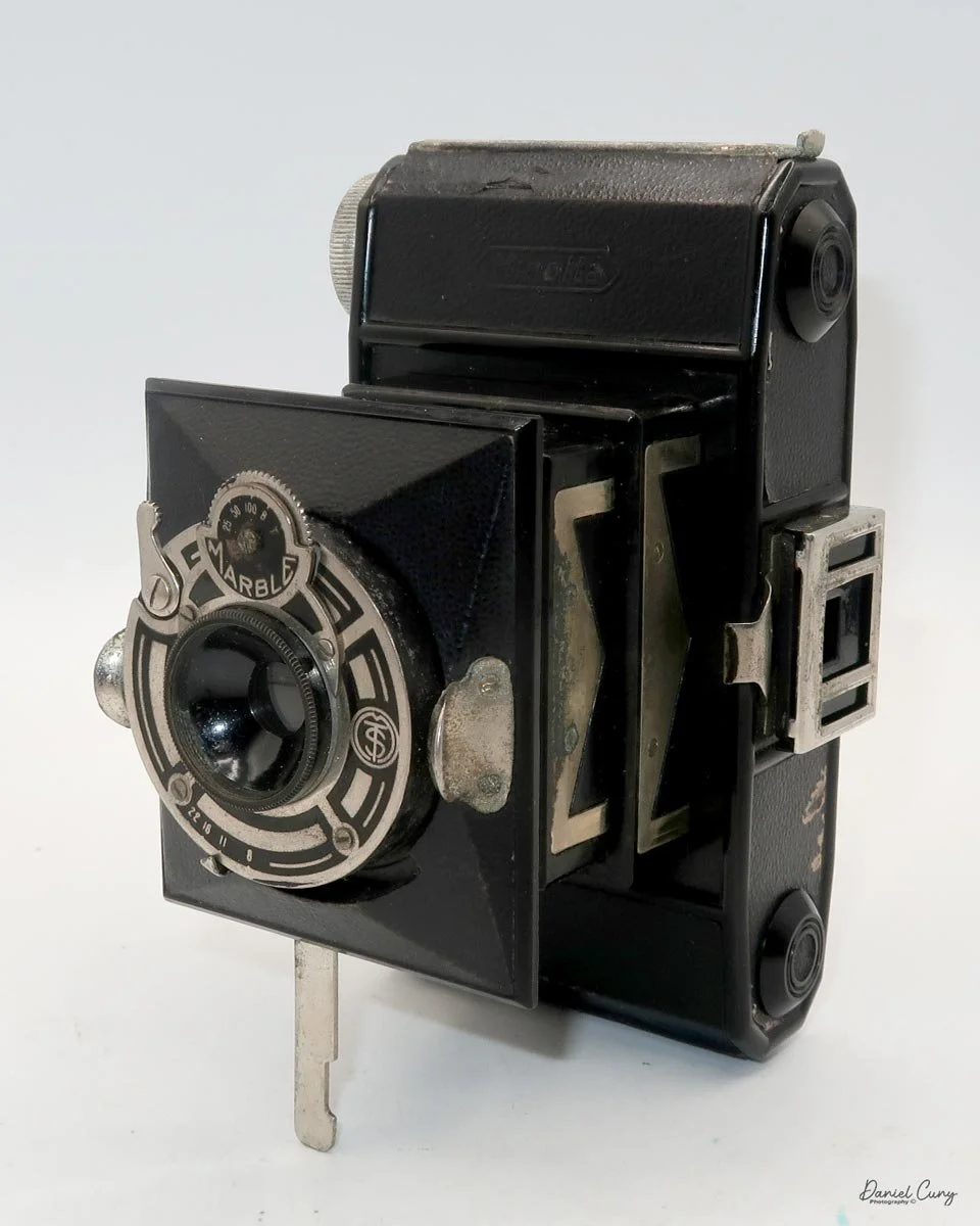 Different angles of the Minolta Vest camera