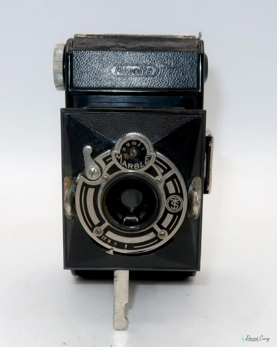 Different angles of the Minolta Vest camera