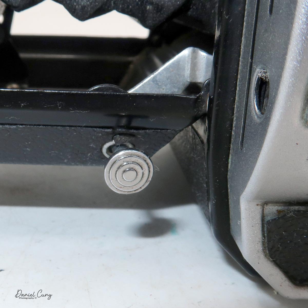 Shutter release on lens door.