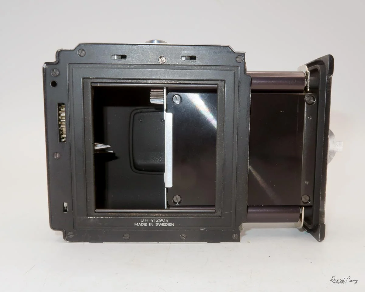 Once film is loaded, put chamber back in film back.