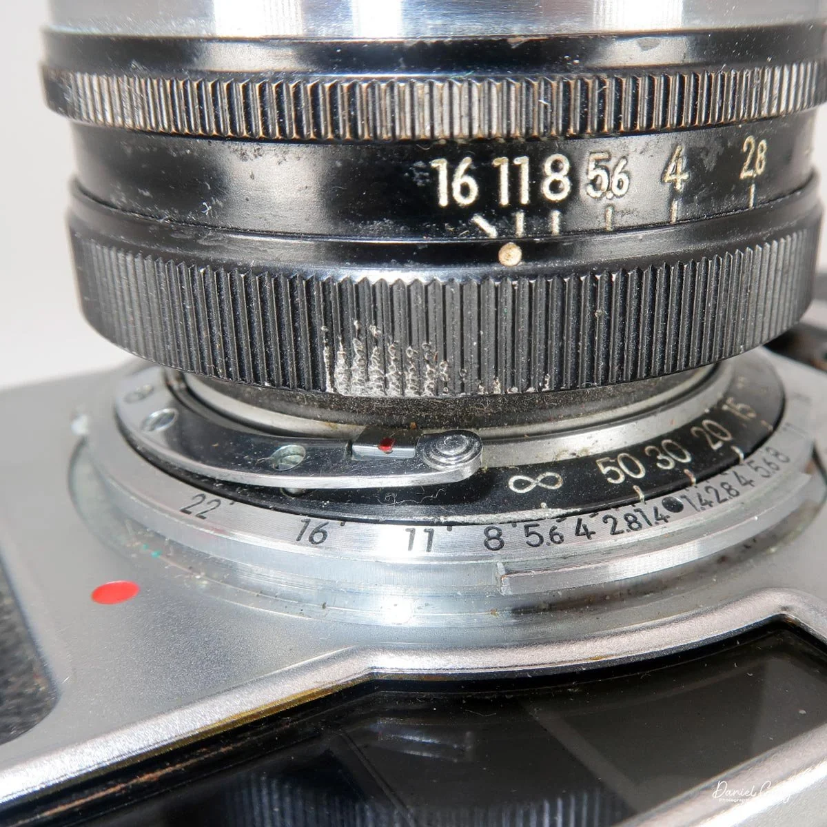 Lever to press down to remove the lens.