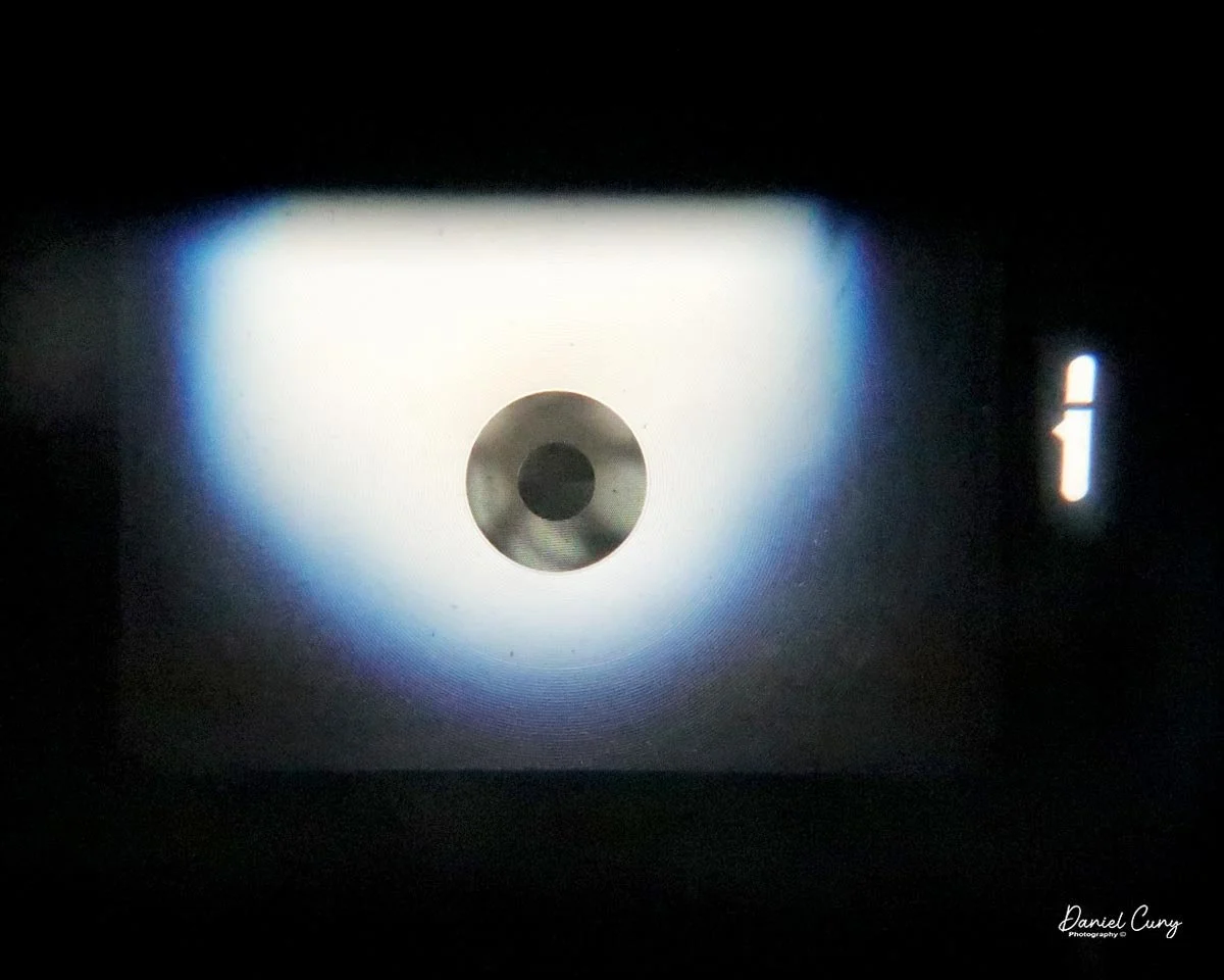 Looking through the viewfinder with meter on the right