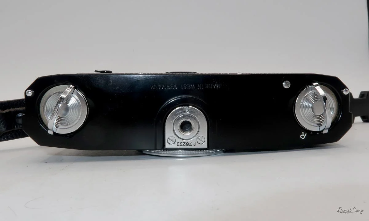 Bottom latches to remove camera's back