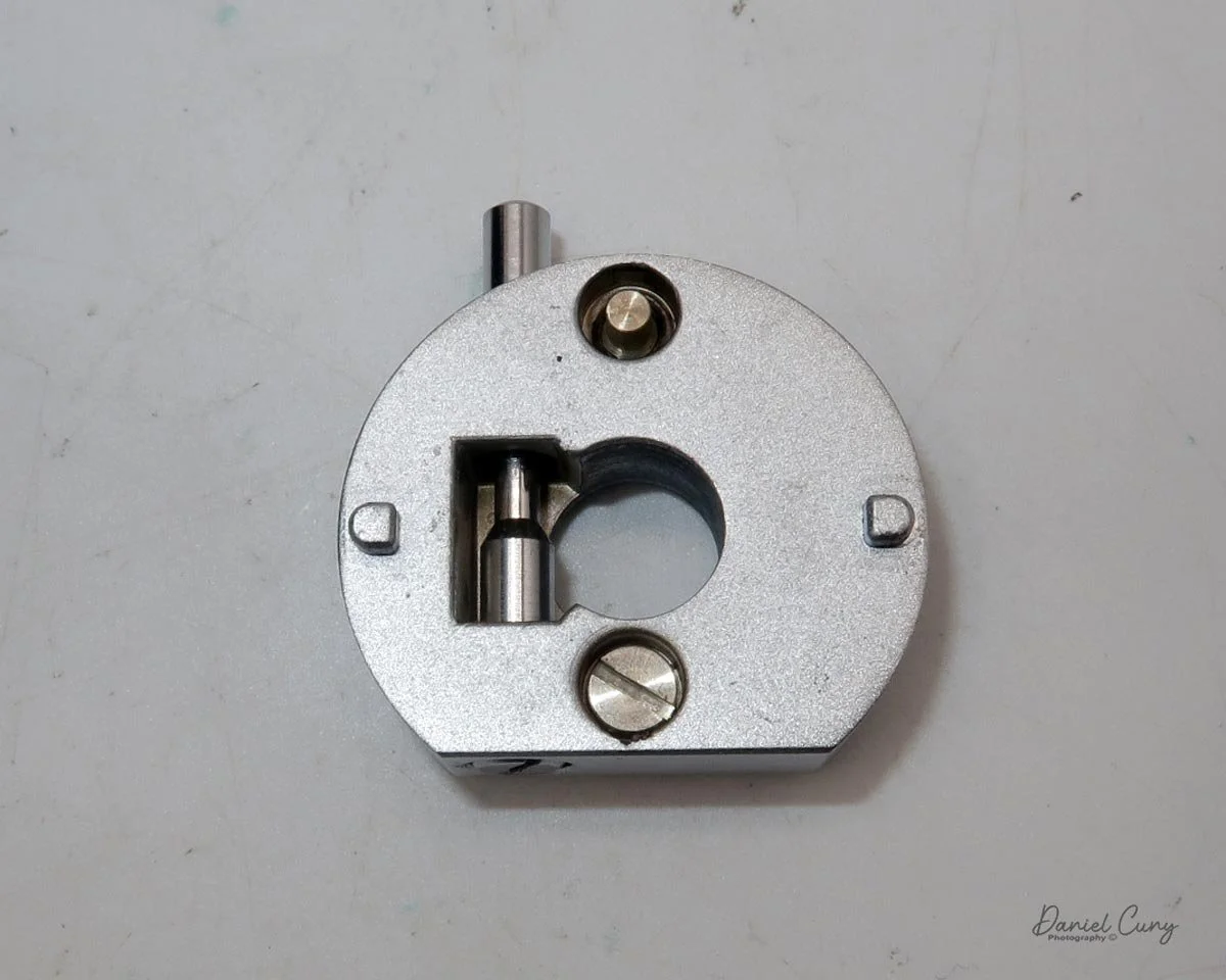 Press in button to remove the mount