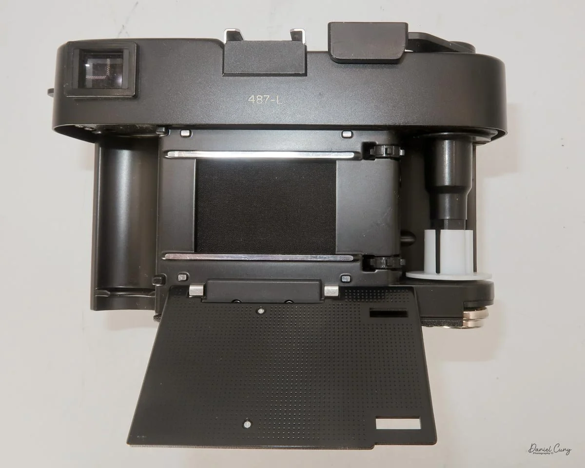 Flip pressure plate down to load film