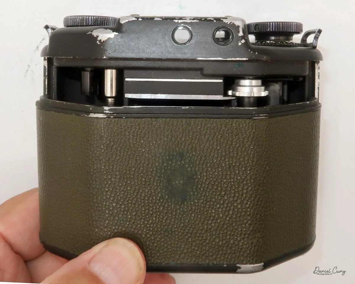 Slide film door off camera body