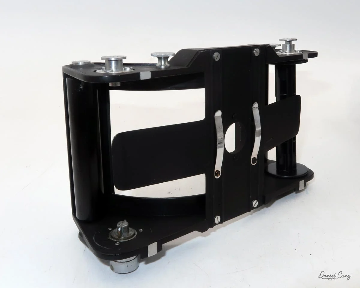 Slide out the insert to load film.