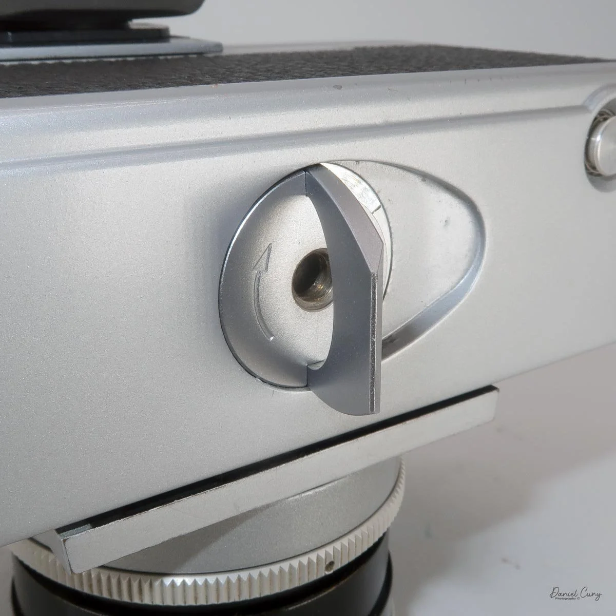 Turn lever to unlock the film back