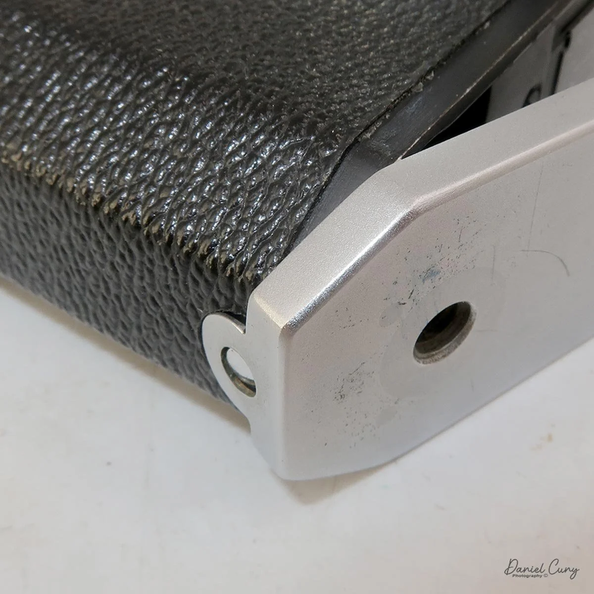 Clip film back into place and lock the door.