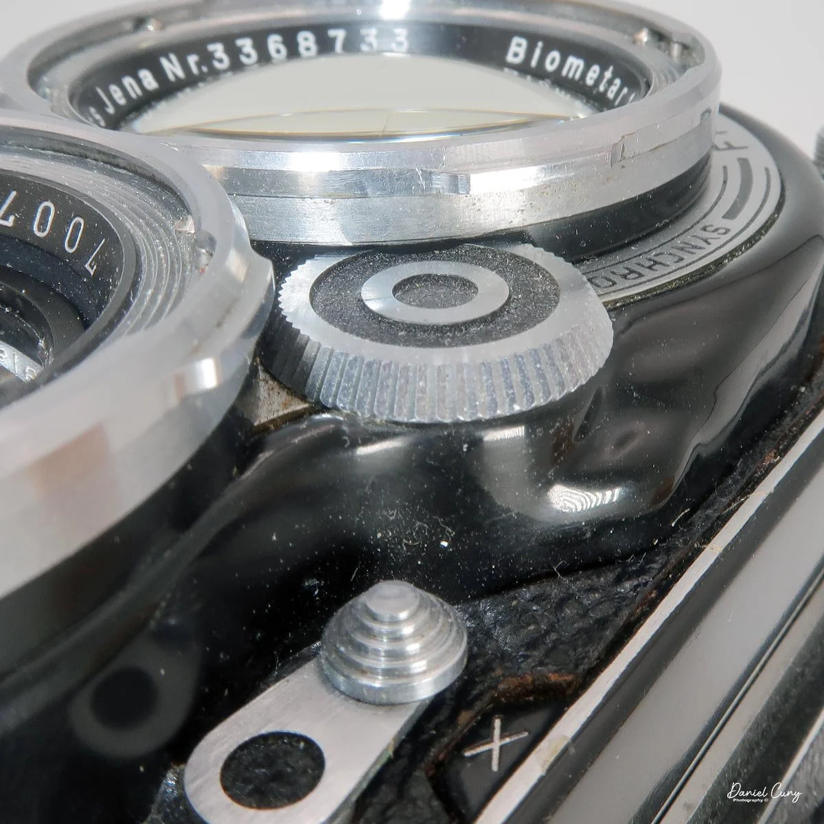Wheels to turn to set aperture or shutter speed.