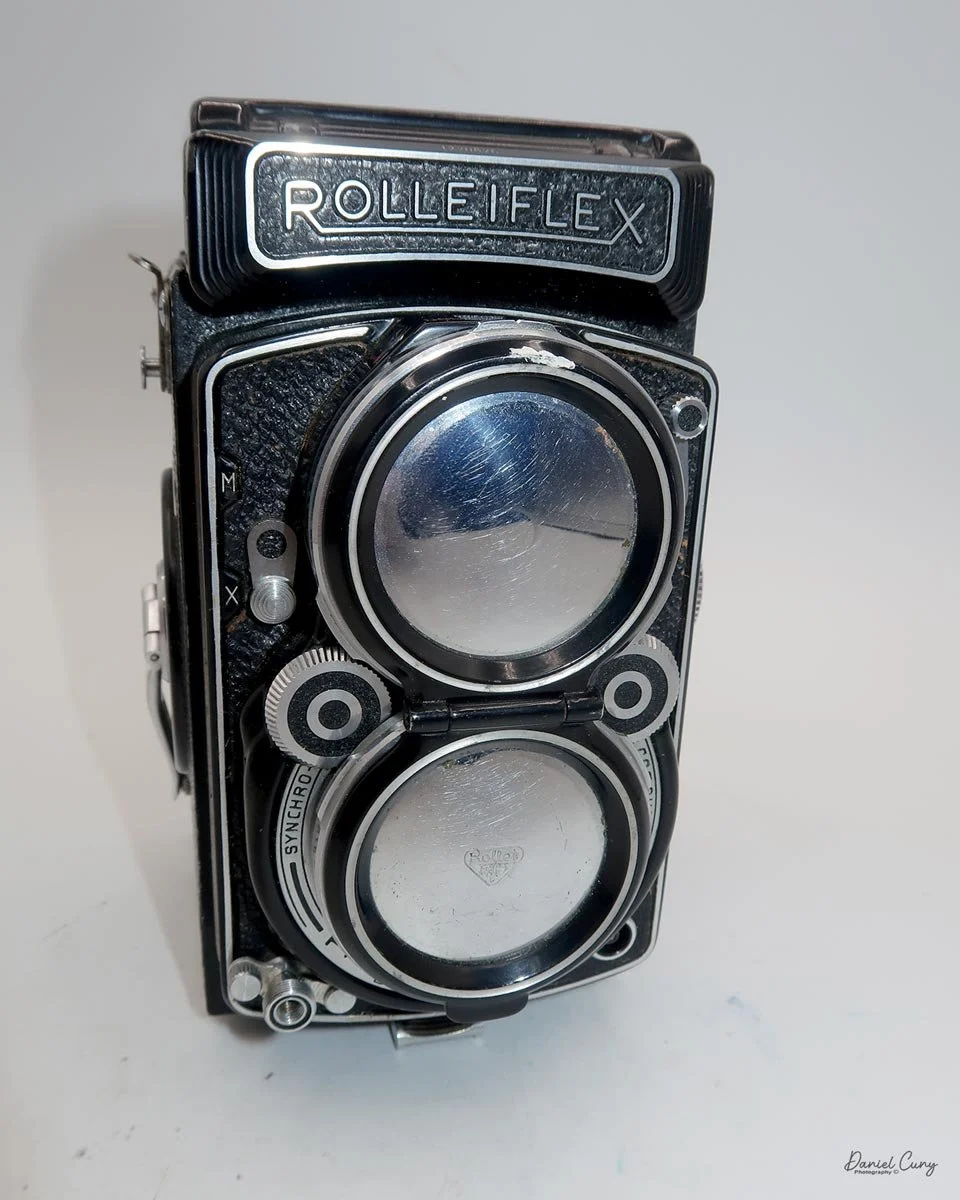 Slide down and clip over the taking lens