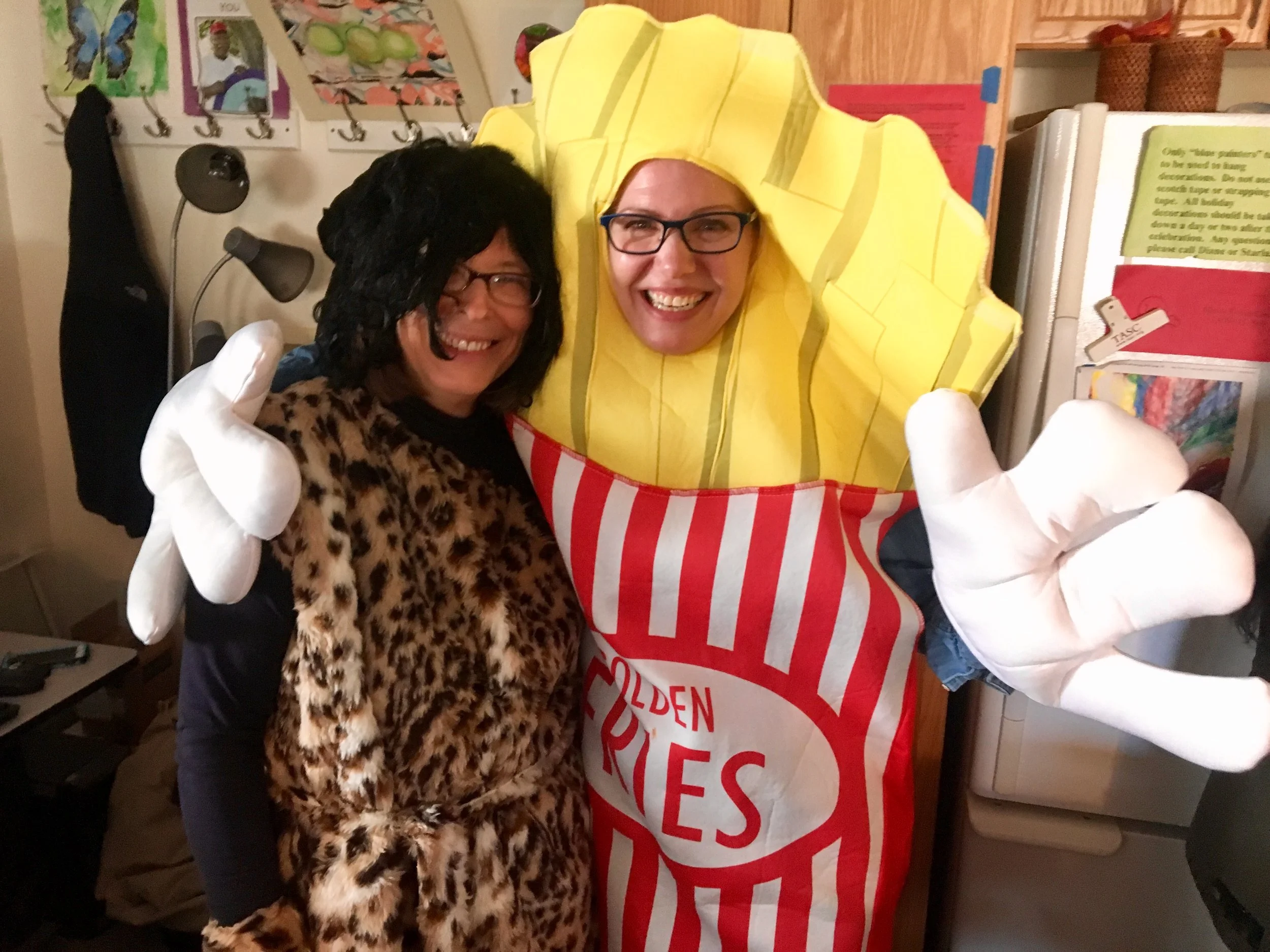 (Left) Impact's Accounting Manager Mary Ann Kearns and (Right) Chief Development Officer, Dena Malikowski pose in their Halloween costumes
