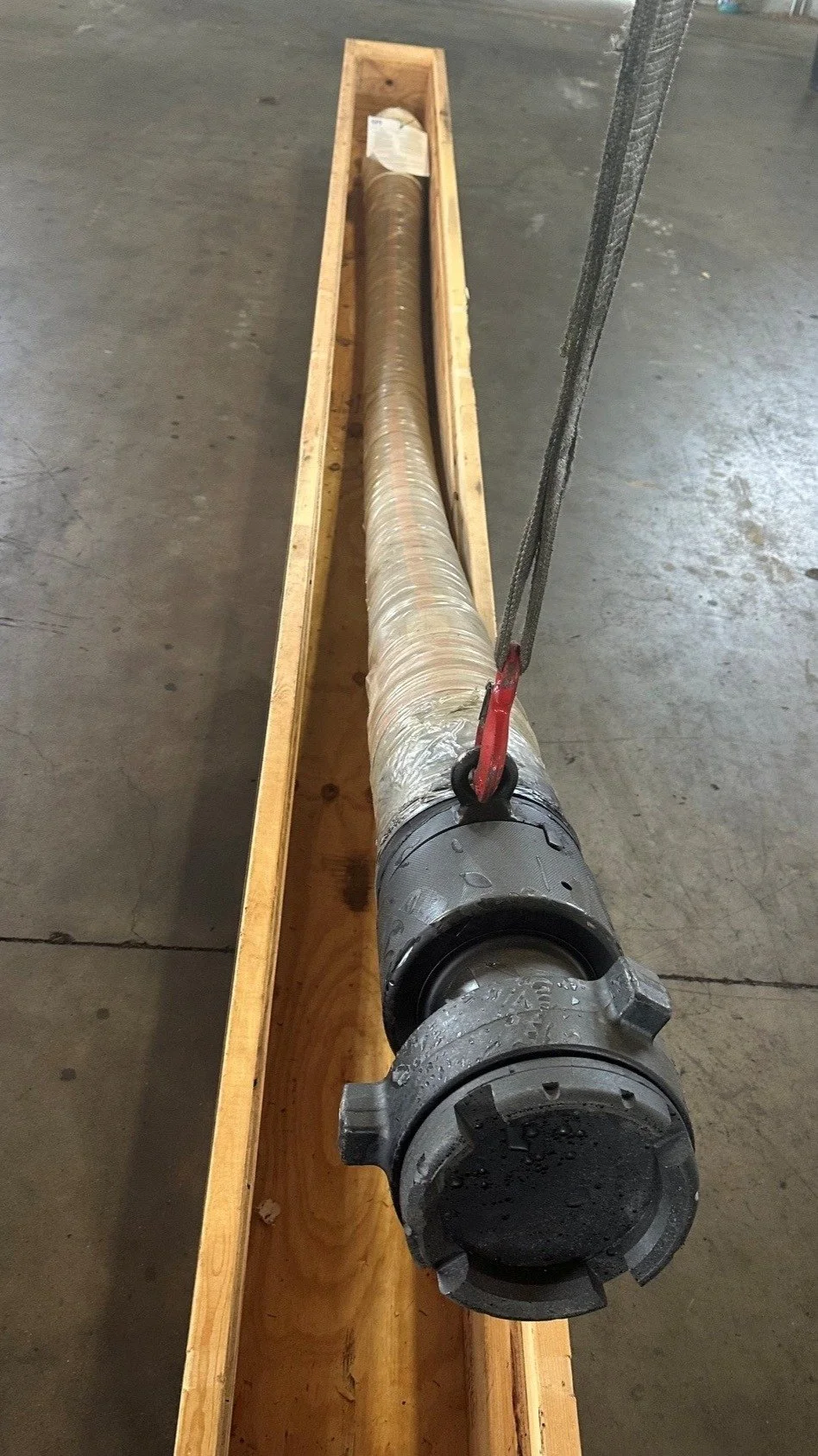 Copper State Rubber Vibrator Hose crated for shipment with protective wrap and coupling