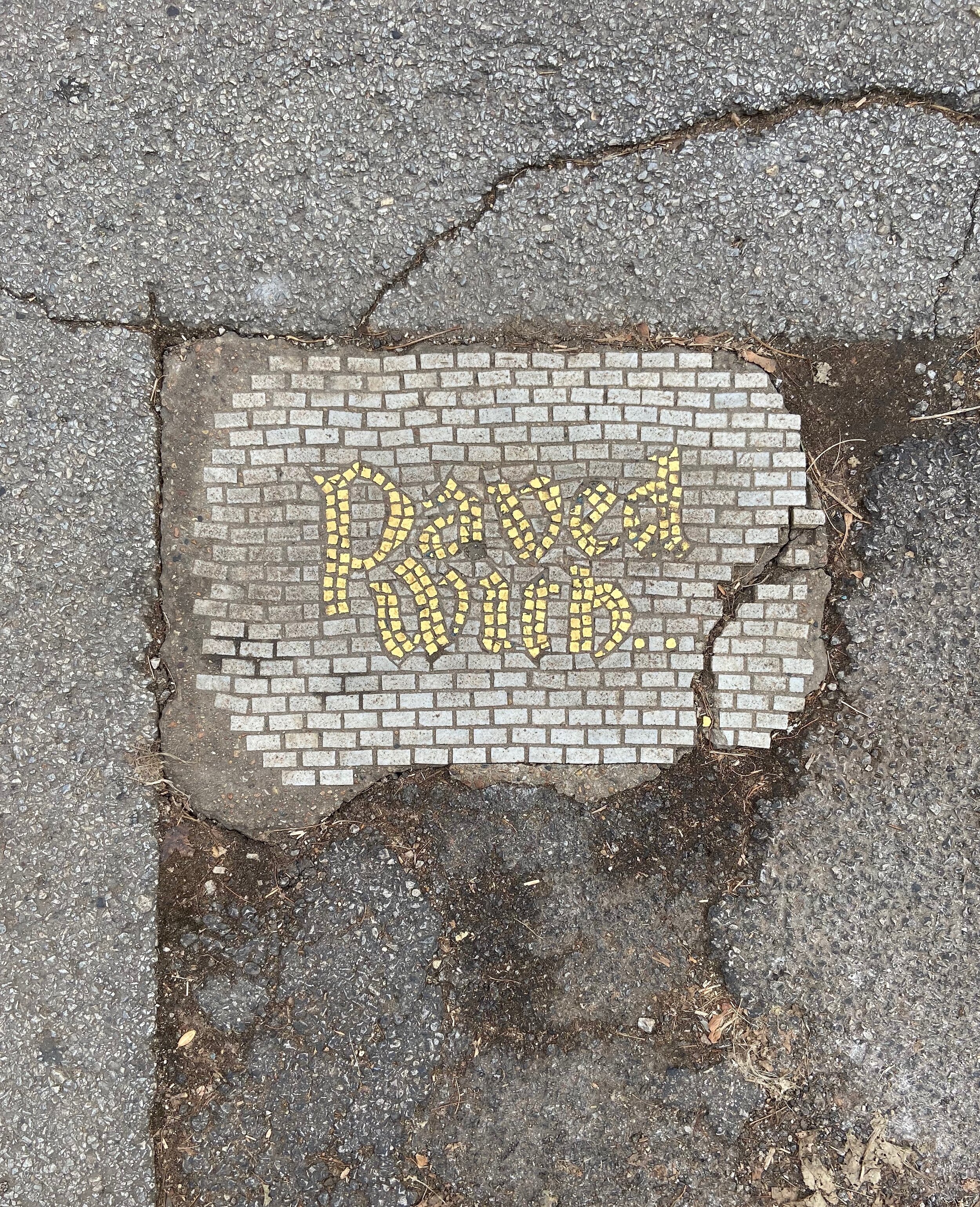 Jim Bachor’s Mosaic Potholes, Example in West Town at 815 N. Paulina St.
