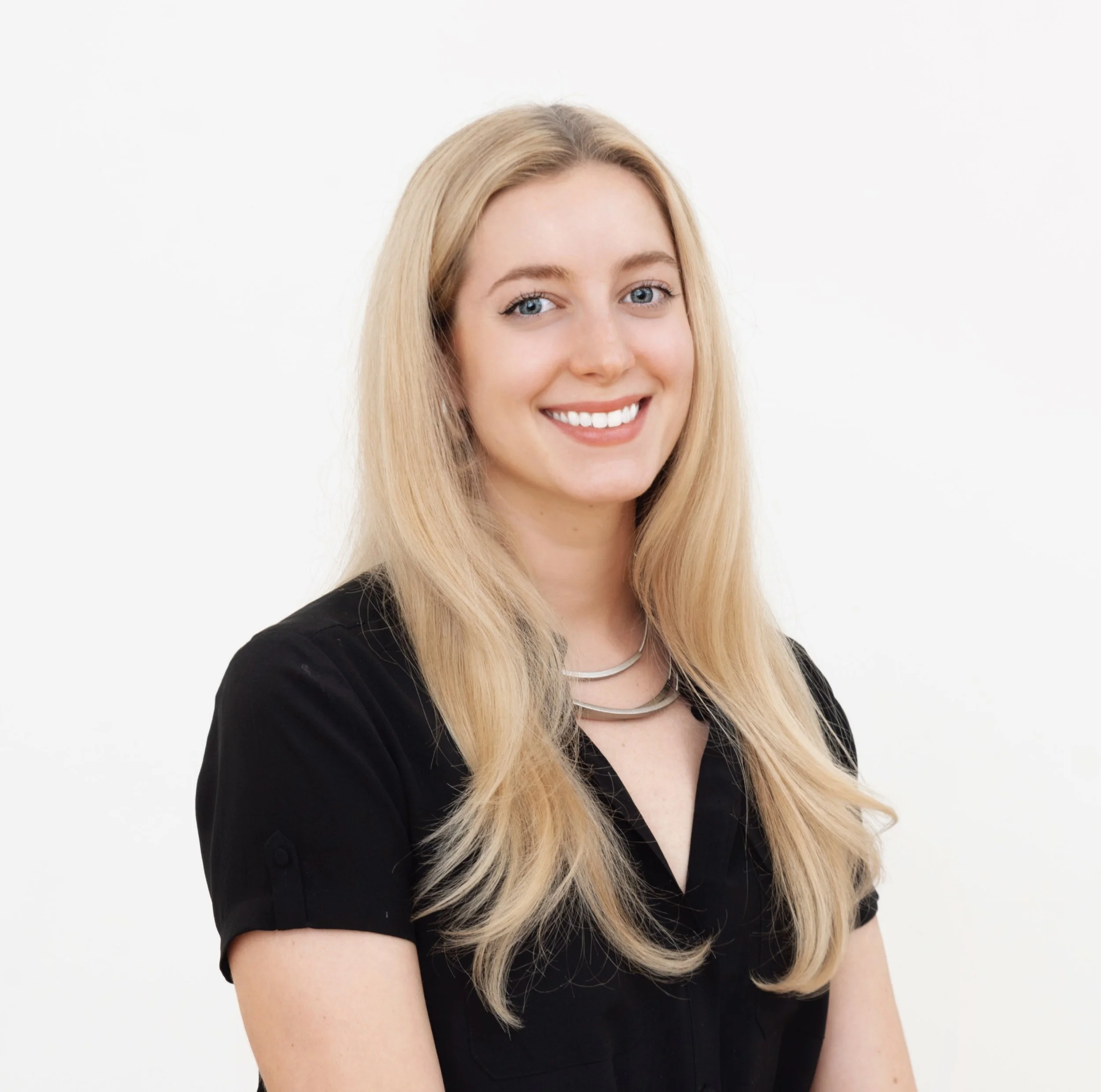 Headshot of Maura Connors, Studio Operations Manager at DeGroot Fine Art, a full-service corporate art consulting firm