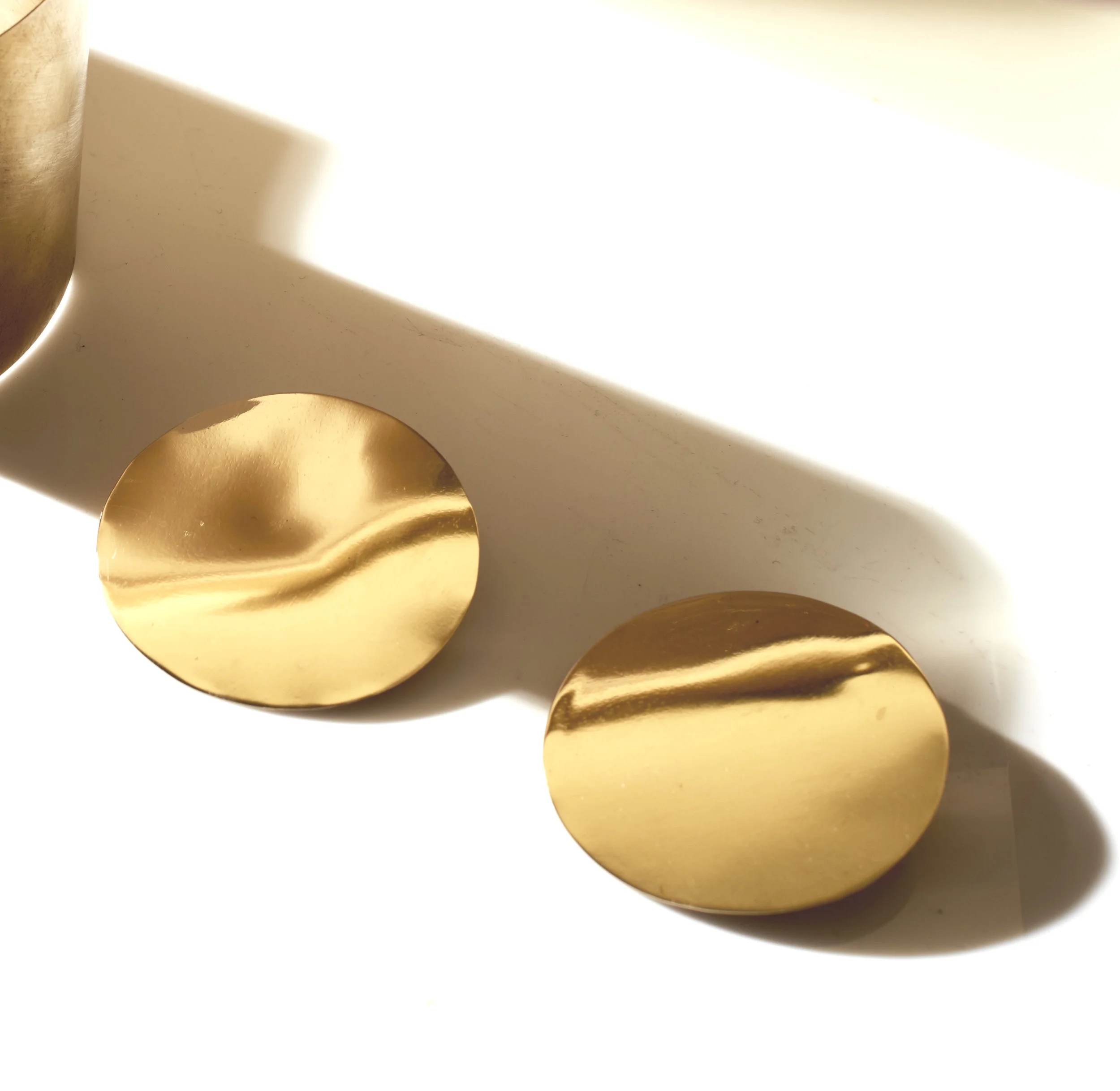 Large gold circle form Earring