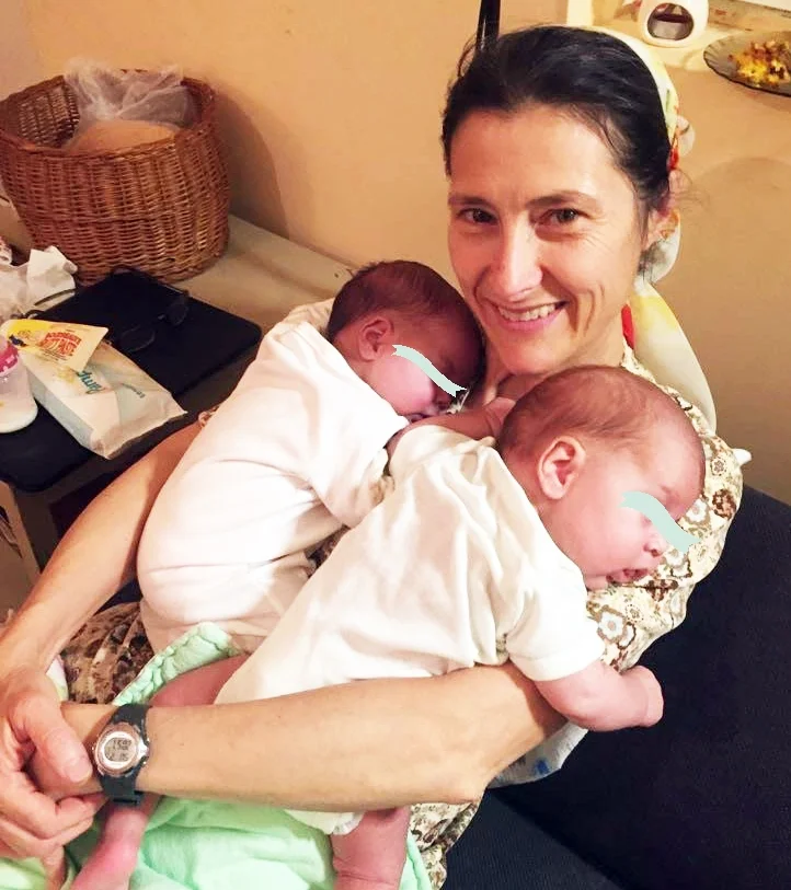 Gabi with both babies, shortly after bringing them home.