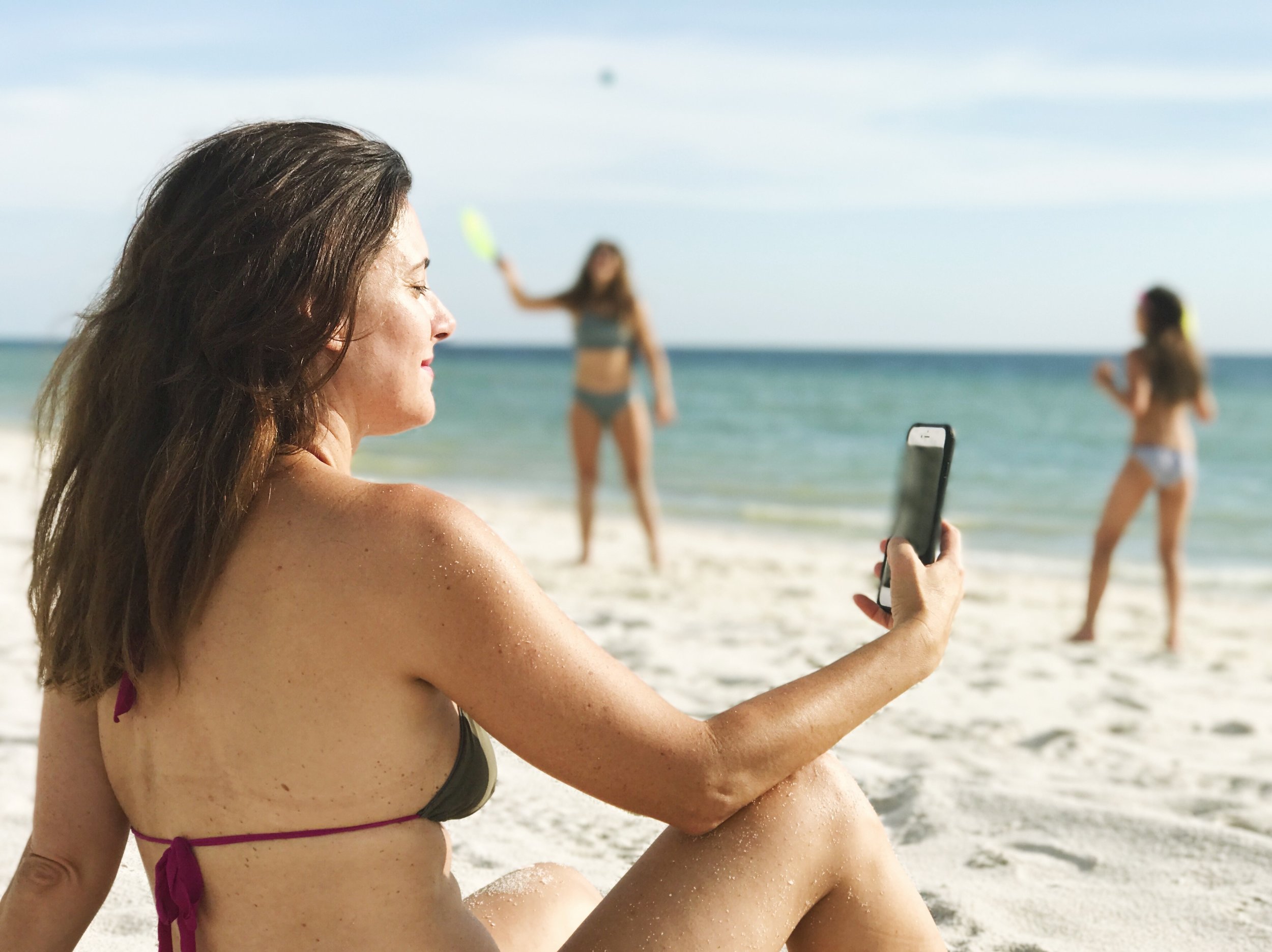 Yes, that's me on the beach with my phone, and if you read through, you'll get why. . .