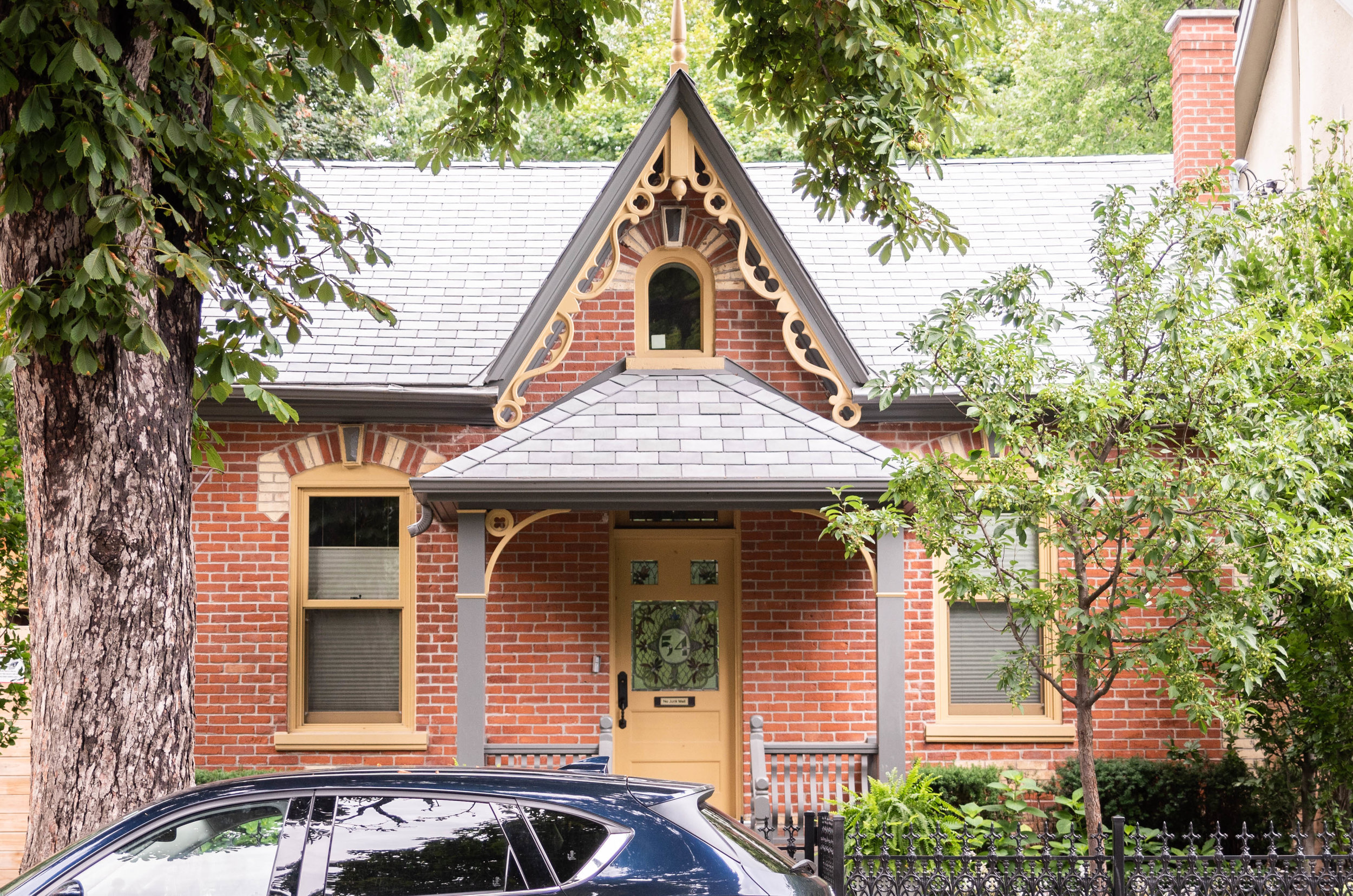 Cabbagetown Cottage This Cabbagetown home had strict heritage guidelines with which to comply. The original Worker’s Cottage was retained and restored. Passersby can only see the original building, and not the thoroughly-modern, 2-storey rear addition. Walking through the front door is like Alice passing through the looking glass. The interior and the rear garden are another world of large, high, and very contemporary spaces contrasting with the former, modest Victorian home. The rear yard is bisected by the lane-accessed garage, creating an urban patio landscape adjacent to the house, and a natural oasis farther beyond. The garage can open on three sides, allowing it to double as a covered outdoor entertainment space which fuses the two halves of the garden. The design of this home is featured by the Cabbagetown Heritage Conservation District Advisory Committee to show that it was possible to both comply with the heritage guidelines and to have a modern home. The two ideas need not be mutually exclusive. Approvals included Heritage, Committee of Adjustment, and Urban Forestry.