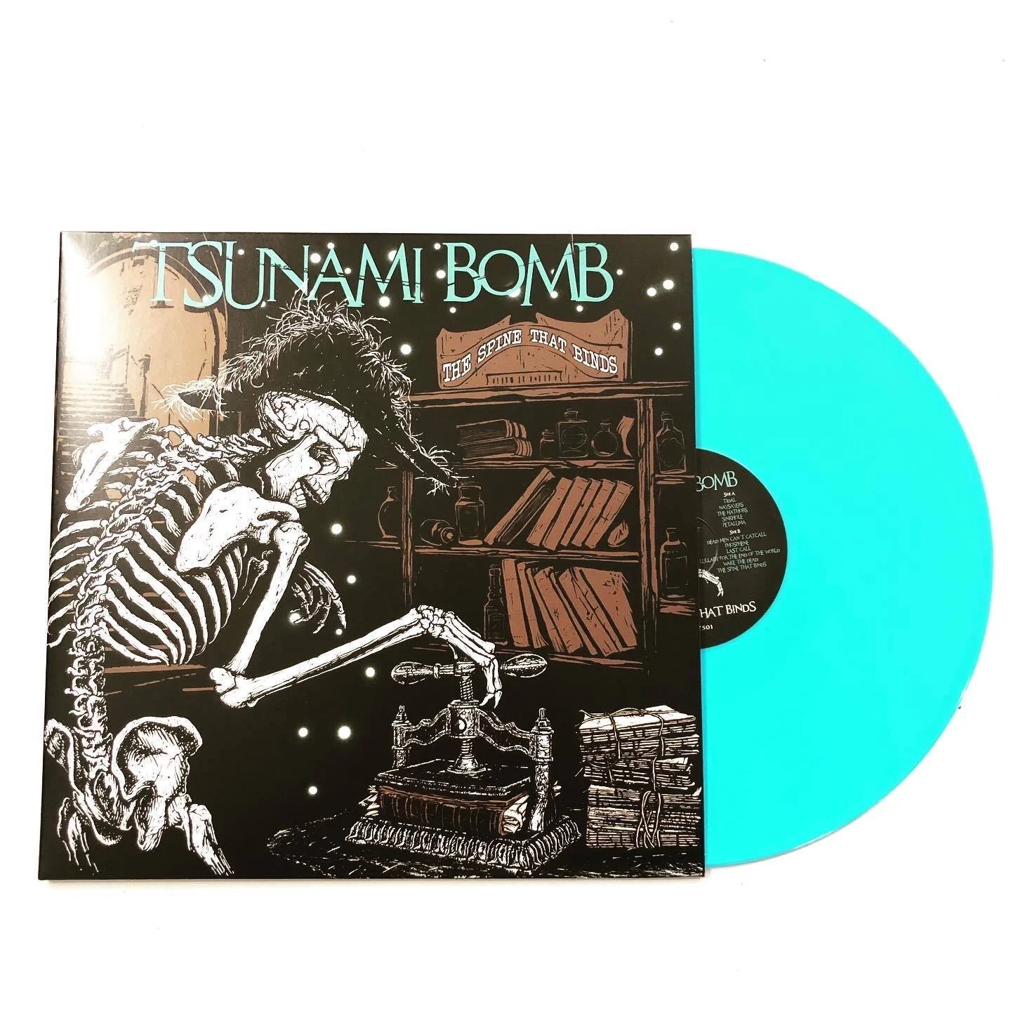 Limited Edition "The Spine That Binds" turquoise vinyl LP on sale at Alternative Tentacles