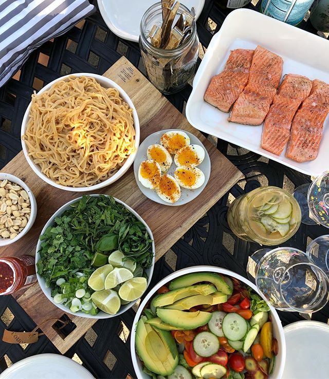 Rooftop noodle night :) Cold sesame noodles, thai chili pickles, jammy eggs w togarashi, roasted trout and all the herbs. #homemade #summer