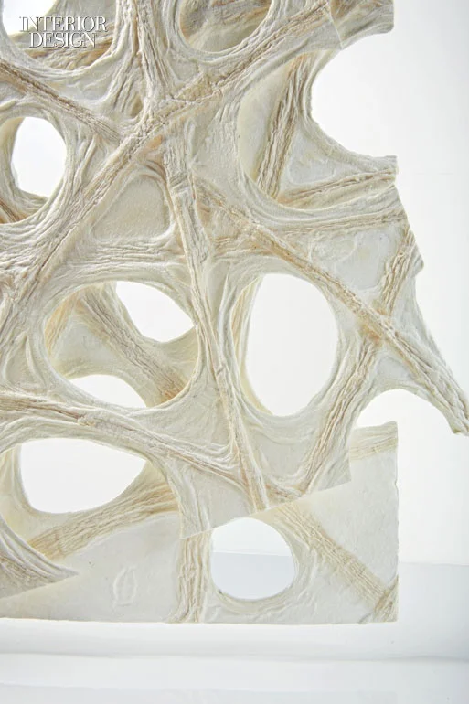 Washi paper from Naganaru Specialty Papers. Composition: plant fibers. Notes: A screen is dipped into pulp to produce paper which is then coated in another pulp layer to create lace in an irregular pattern that produces the illusion of air permeating the fibers.