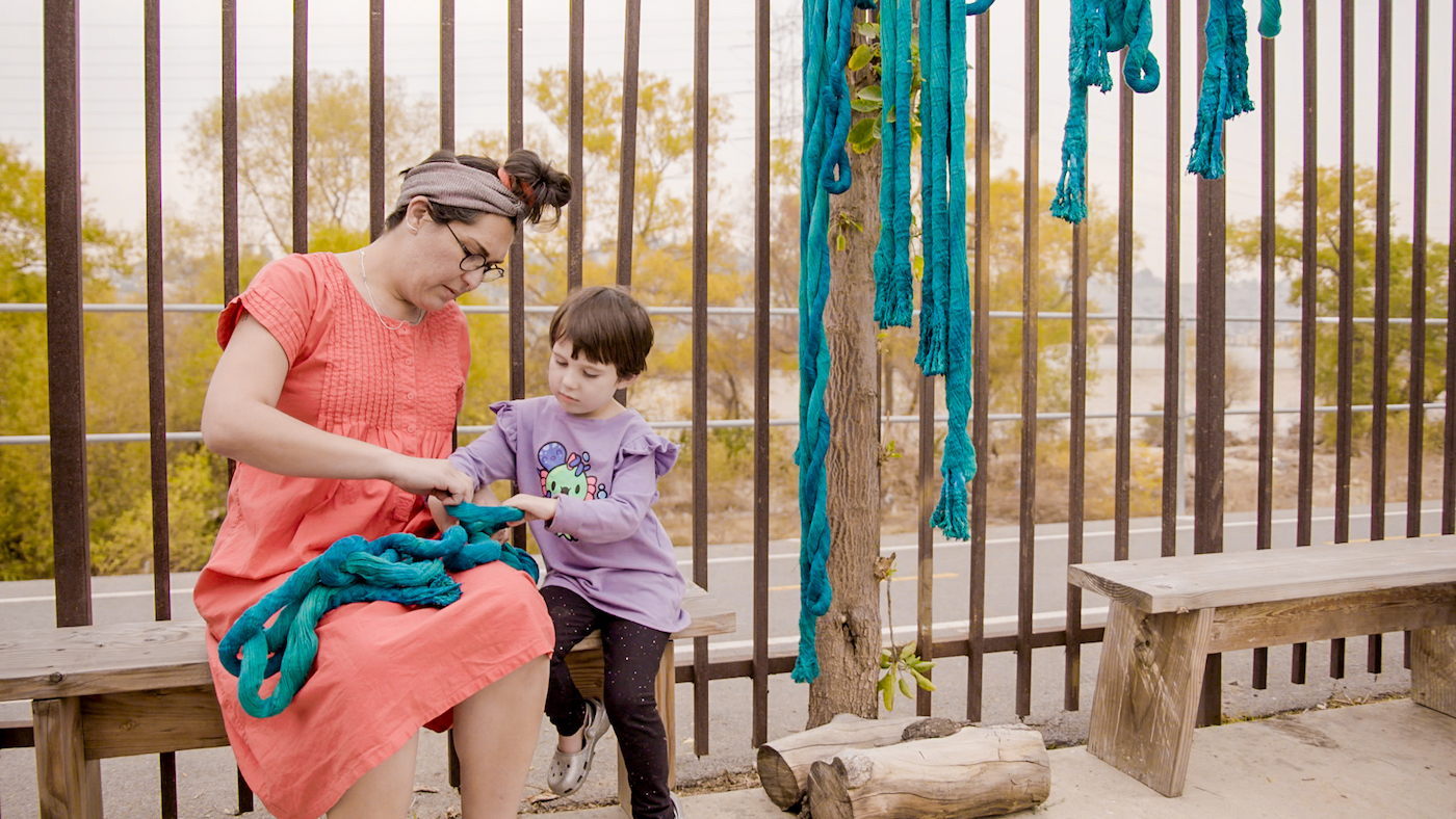 Tanya Aguiñiga with her daughter, Io. Film still from Artist and Mother , part of KCET’s Artbound series and a co-production of KCET and Sylvia Frances Films.