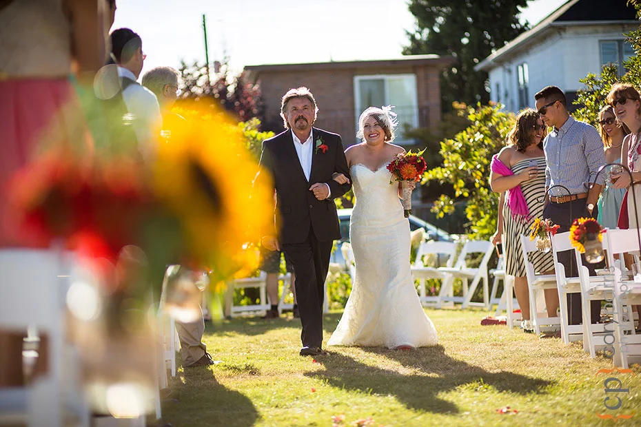 bride and groom walking down the aisle at the beacon hill garden house wedding venue in Seattle
