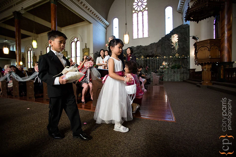 flower girl and ring bearer walking down the aisle