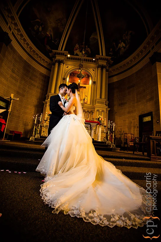 Monica and Jimmy portrait at the altar at Immaculate Conception