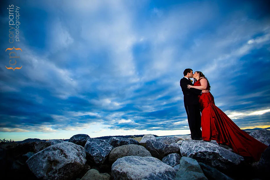 bride and groom with red dress on the seattle waterfront