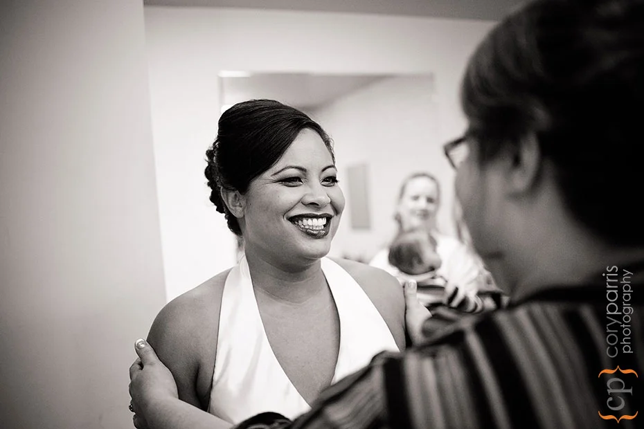 Jacqui and her mom as she puts on her dress.