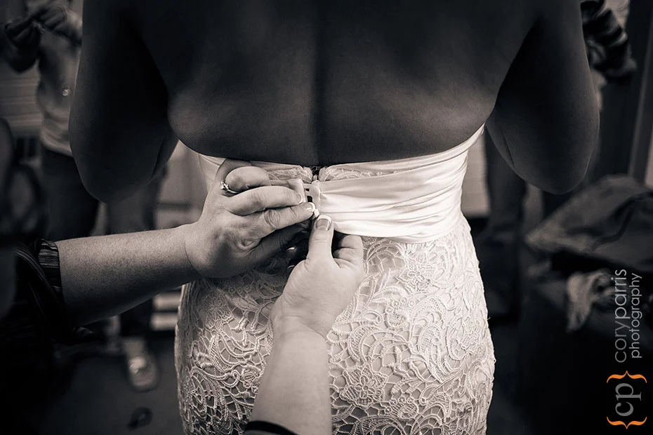 buttoning the dress at St. Monica
