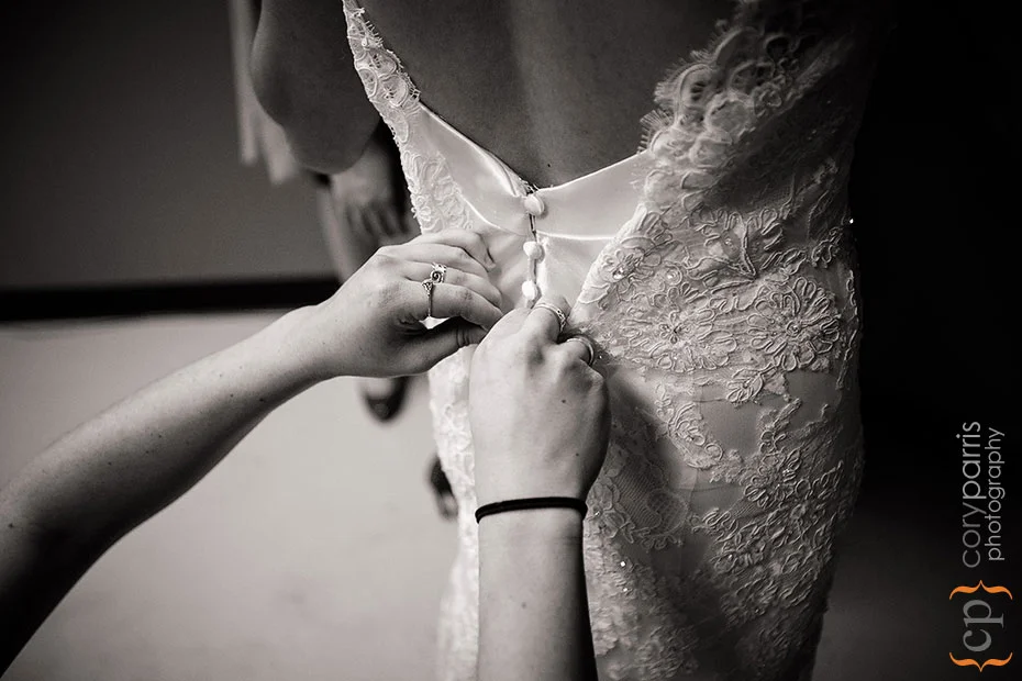 buttoning the wedding dress