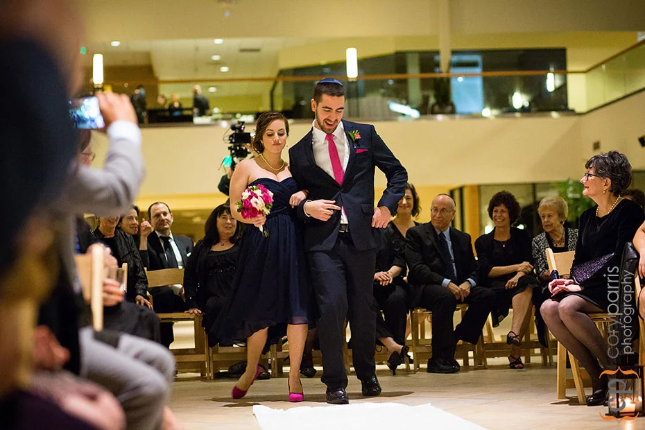 bridesmaid and groomsman dancing