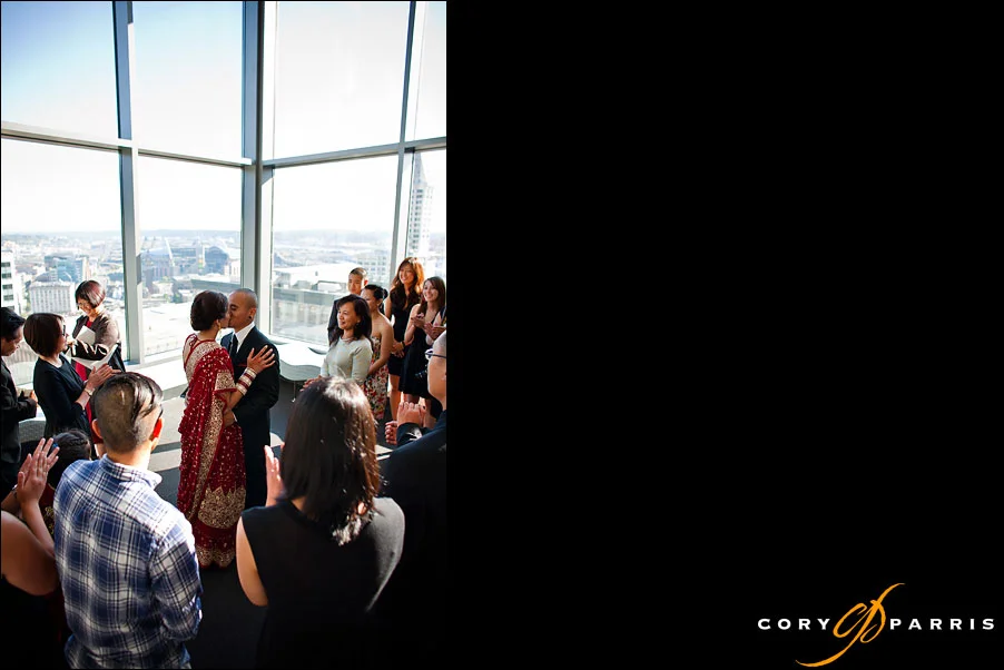 bride and groom kissing during wedding ceremony by seattle wedding photographer cory parris